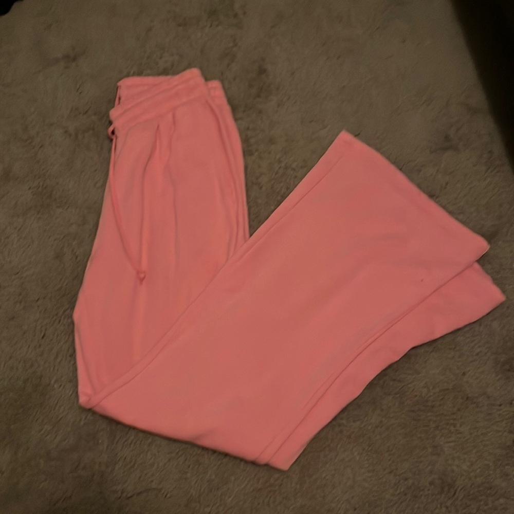 Small pink flare pants from PINK with adjustable waistline.